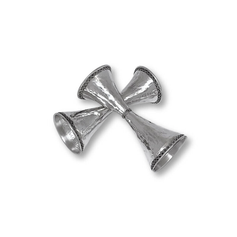 Diagonal arrangement of hammered silver candlesticks with artistic curves