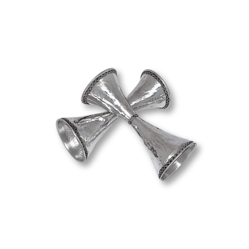 Diagonal arrangement of hammered silver candlesticks with artistic curves