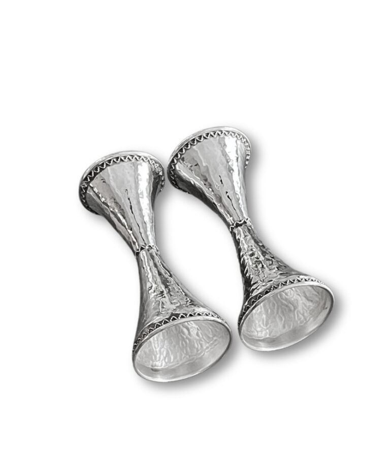 Bottom perspective of silver candle holders showing flared base detailing