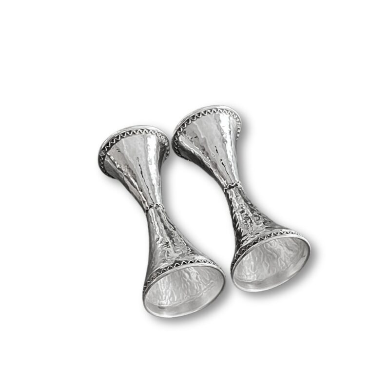 Bottom perspective of silver candle holders showing flared base detailing