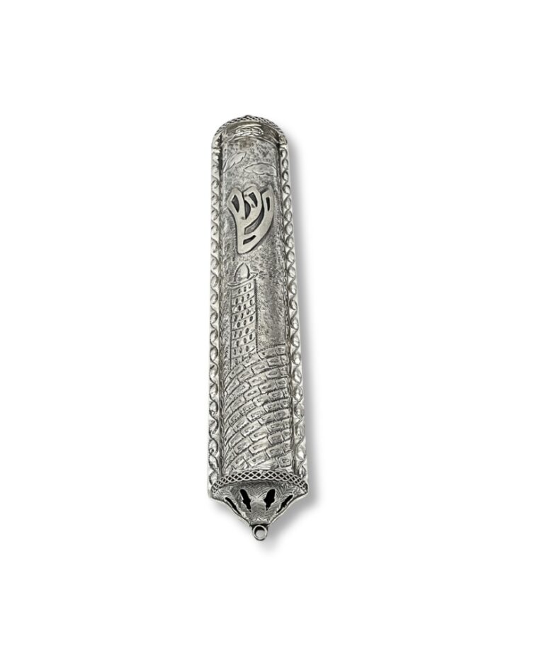 Close-up of raised Shin symbol on decorative silver mezuzah with Jerusalem motif
