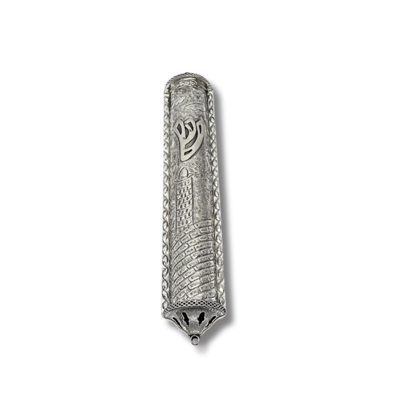 Close-up of raised Shin symbol on decorative silver mezuzah with Jerusalem motif