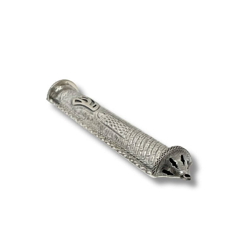 Angled side view of handcrafted silver mezuzah showing ornamental base