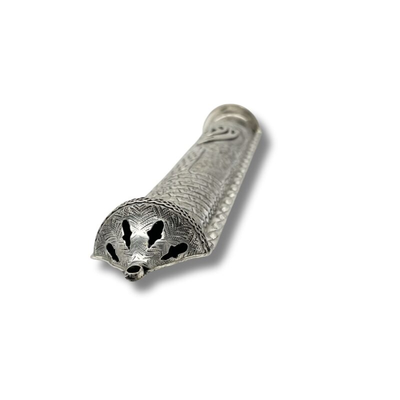 Detailed view of mezuzah end cap with engraved patterns and cut-out design