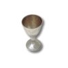 Hand holding a handcrafted Silver Kiddush Cup to show texture and size