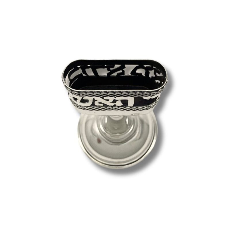 Top view of silver candle holder with intricate cut-out design