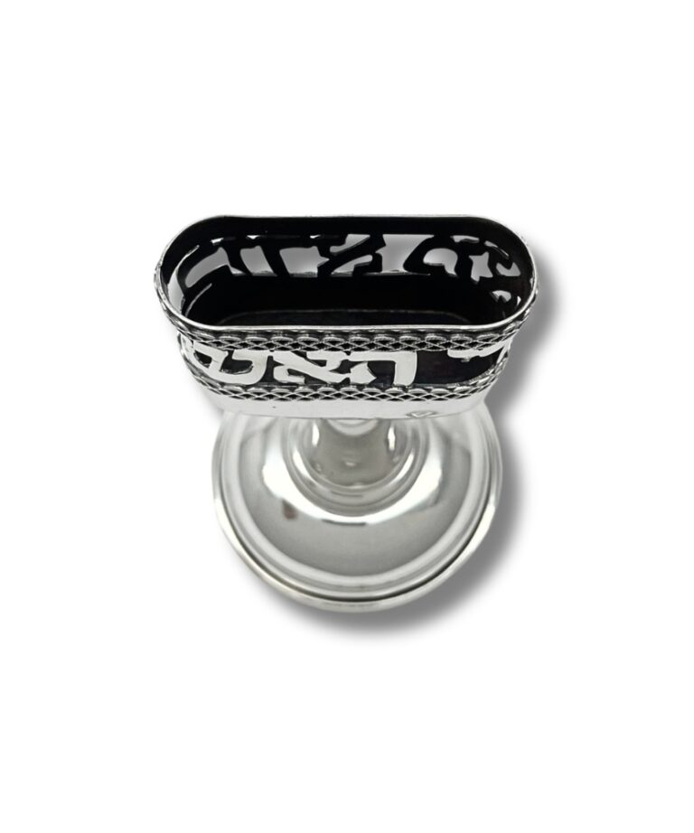 Top view of silver candle holder with intricate cut-out design