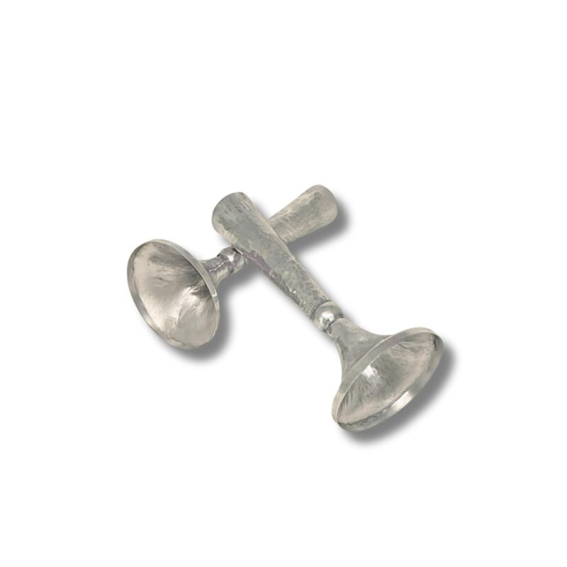 Angled display of hammered silver Shabbat candlesticks