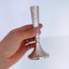 Hand holding Hammered Candlestick showcasing texture