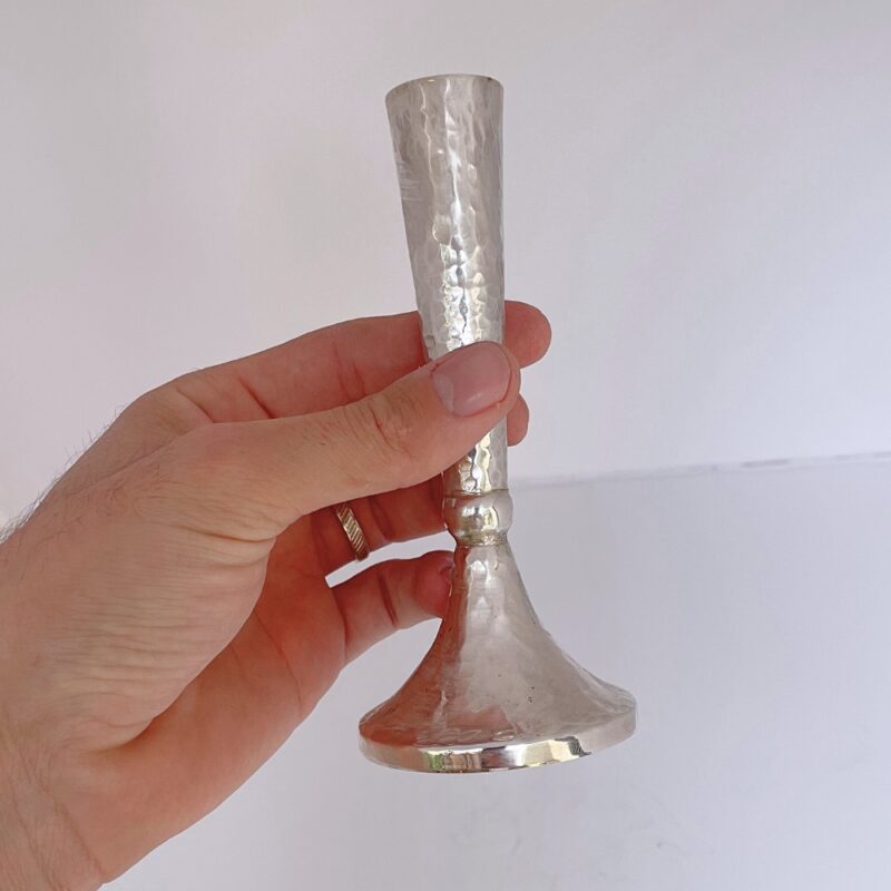 Hand holding Hammered Candlestick showcasing texture