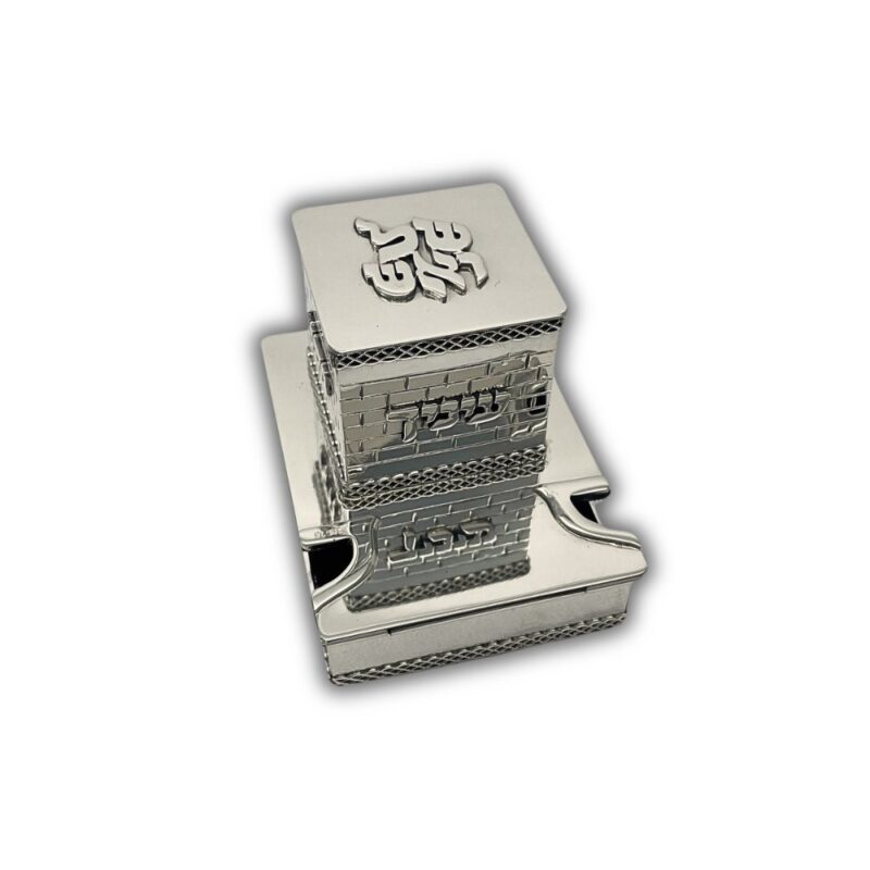 Detailed close-up of Hebrew inscriptions over a brick-patterned silver box
