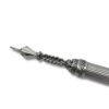 Close-up of ornate torah pointer tip with intricate design