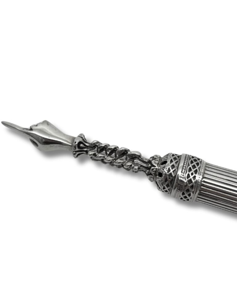 Close-up of ornate torah pointer tip with intricate design