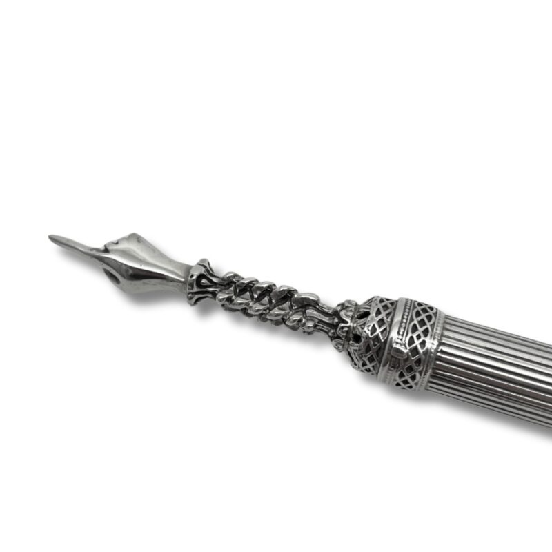 Close-up of ornate torah pointer tip with intricate design