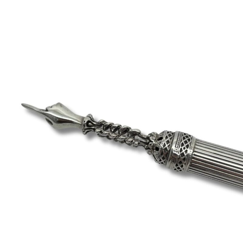 Close-up of ornate torah pointer tip with intricate design