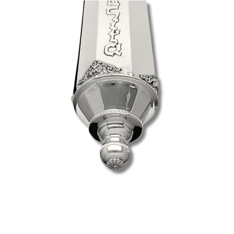 Decorative finial of handcrafted silver scroll case with filigree-style accents