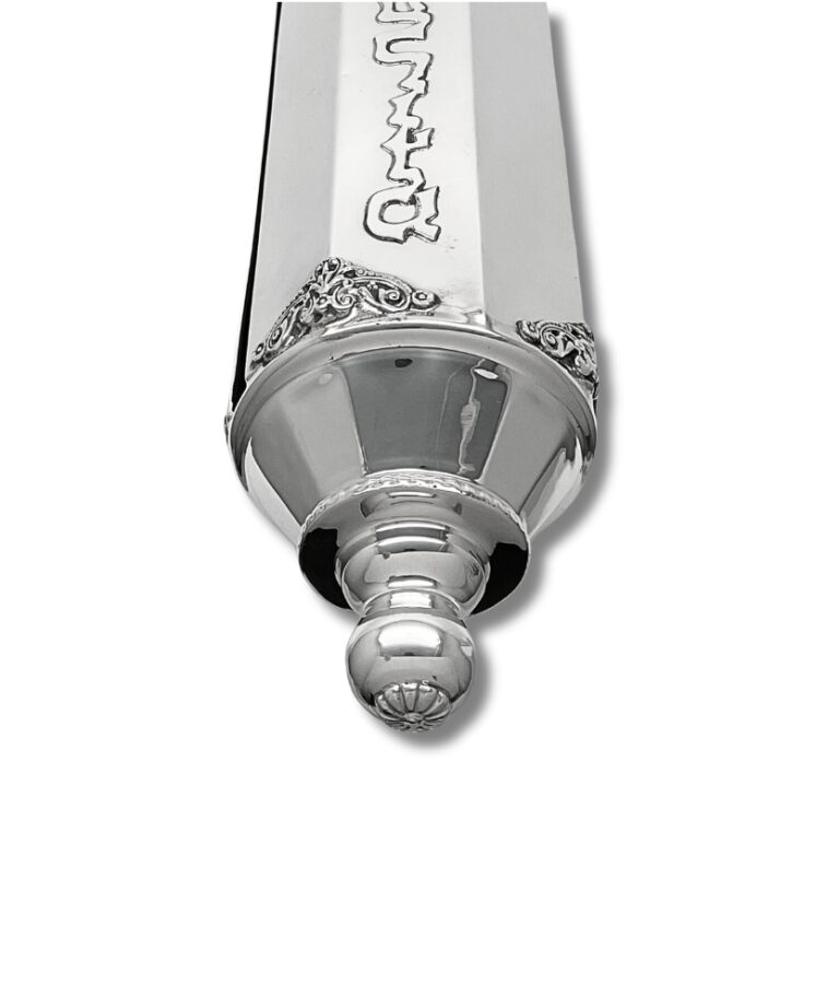 Decorative finial of handcrafted silver scroll case with filigree-style accents