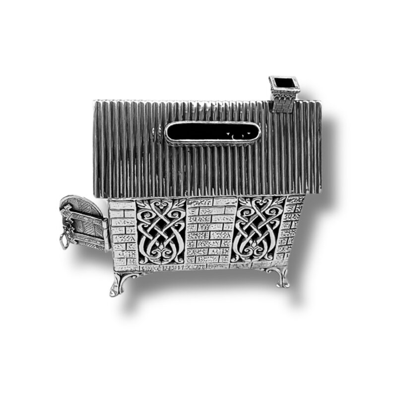 Top view of Tzedakah box showing coin slot and ornate roof design