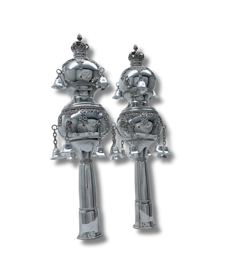 Pair of silver Torah Rimonim displayed upright