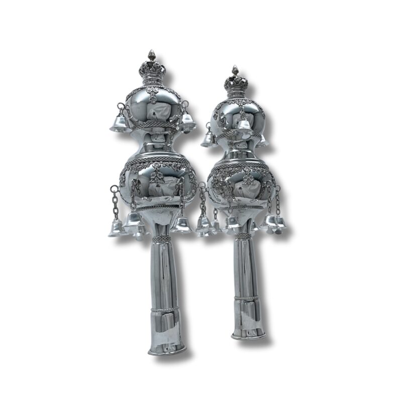 Pair of silver Torah Rimonim displayed upright