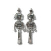 Handcrafted silver Torah finials with intricate decorations and bells