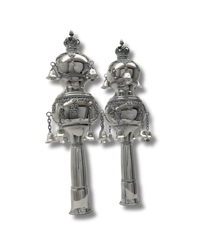 Pair of silver Torah Rimonim displayed upright