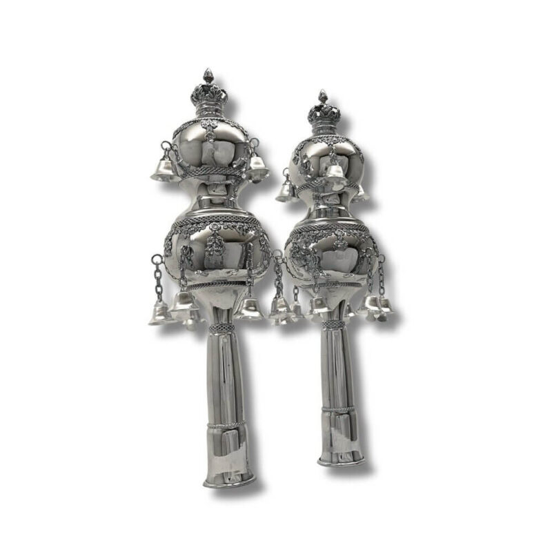 Pair of silver Torah Rimonim displayed upright