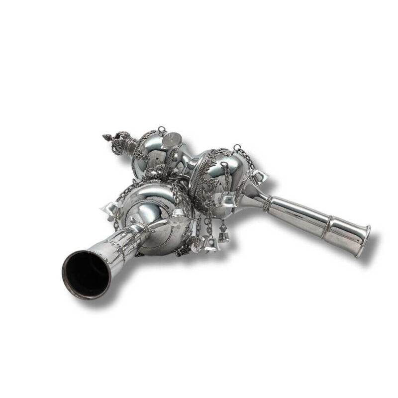 Detailed side view of silver Torah Rimonim with bells and traditional engraving