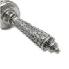 Close-up of the detailed silverwork on the handle with vine and floral patterns