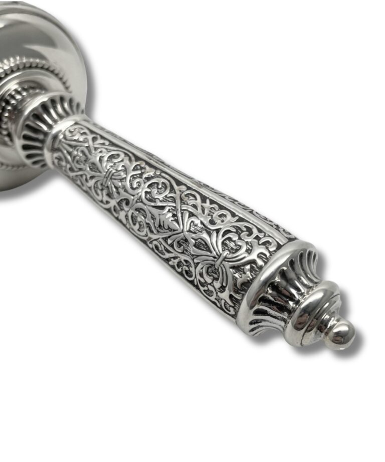 Close-up of the detailed silverwork on the handle with vine and floral patterns