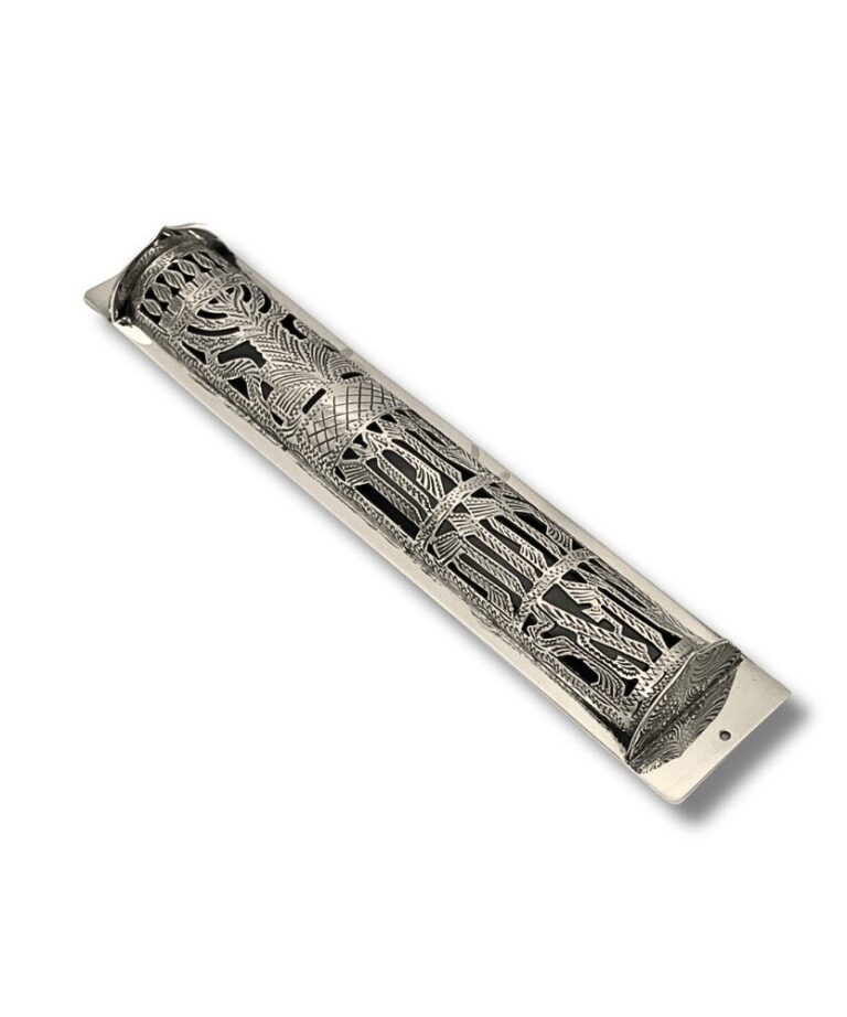 Angled top view of handcrafted silver mezuzah with intricate openwork pattern
