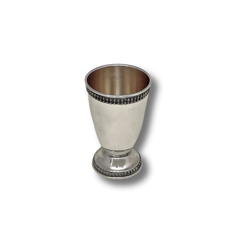 Small silver Kiddush cup with dark filigree rim and gold-plated interior
