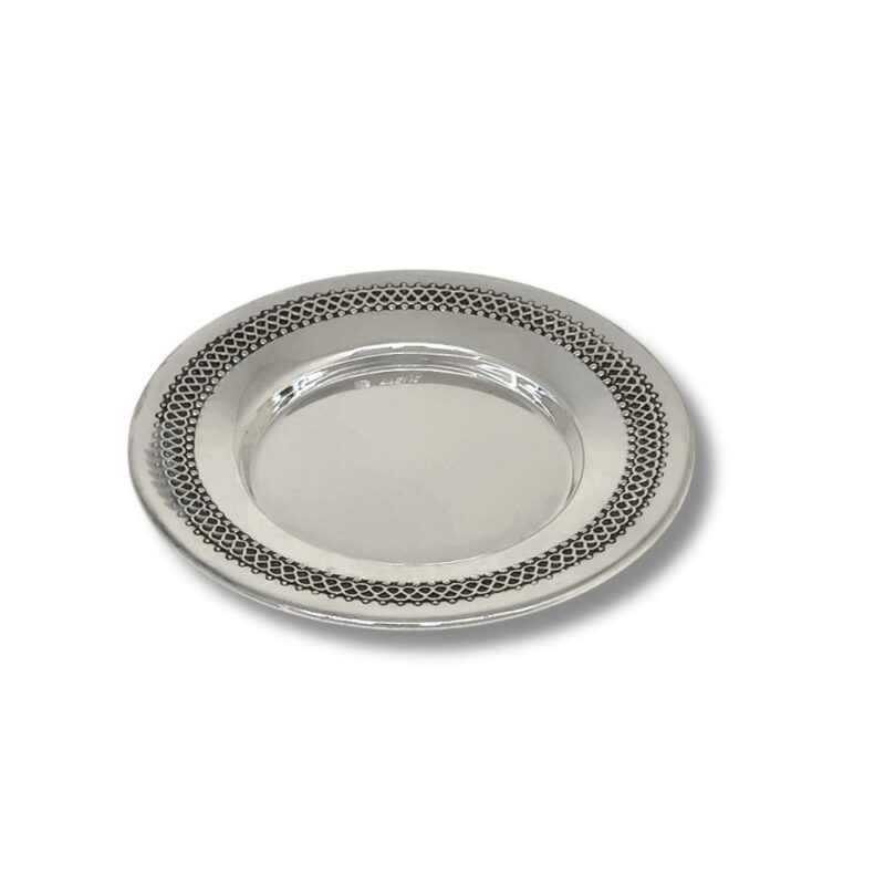 Detailed view of silver Kiddush plate with handcrafted filigree design