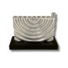 Front view of curved silver menorah with smooth finish and solid base