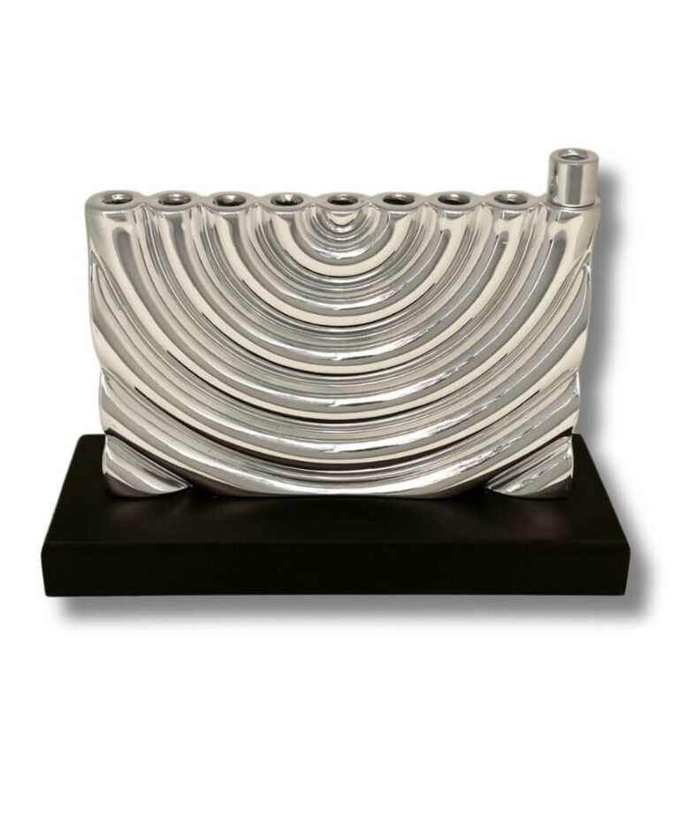 Front view of curved silver menorah with smooth finish and solid base
