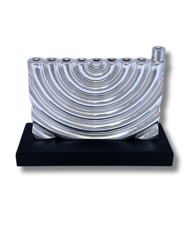 Front view of curved silver menorah with smooth finish and solid base