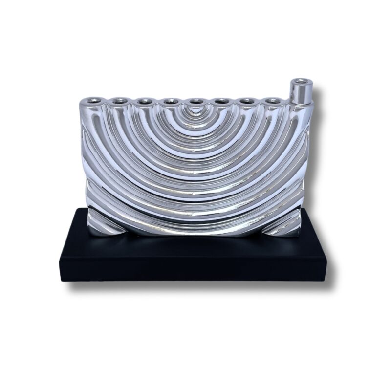 Front view of curved silver menorah with smooth finish and solid base