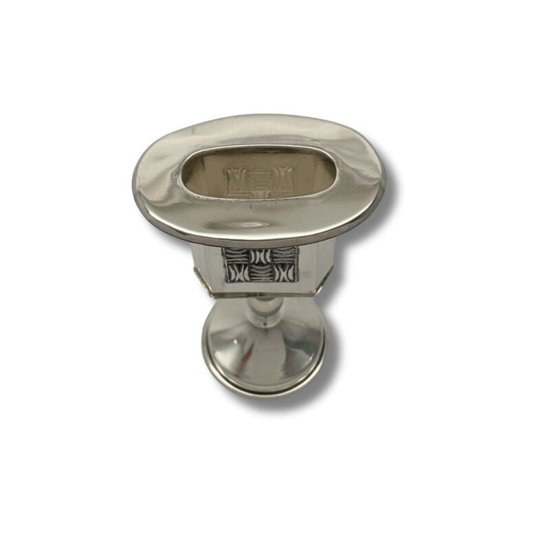 Hand holding silver Havdalah candle holder made in Jerusalem