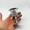 Hand holding silver Havdalah candle holder made in Jerusalem