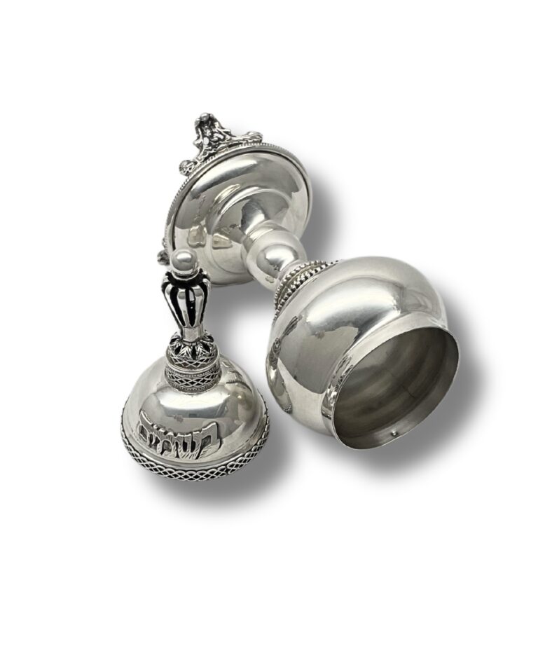 Side view of silver Besamim Box lying flat, highlighting the engraved Hebrew text 'בשמים' and the detailed silverwork around the body