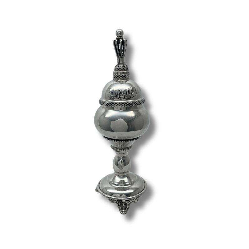 Spice Box displayed on its side, showing the intricate crown-shaped base and polished body