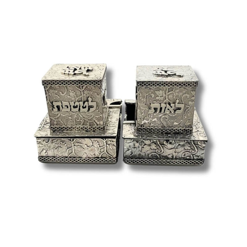 Pair of sterling silver tefillin cases with words "לאות" and "לטטפת" on front