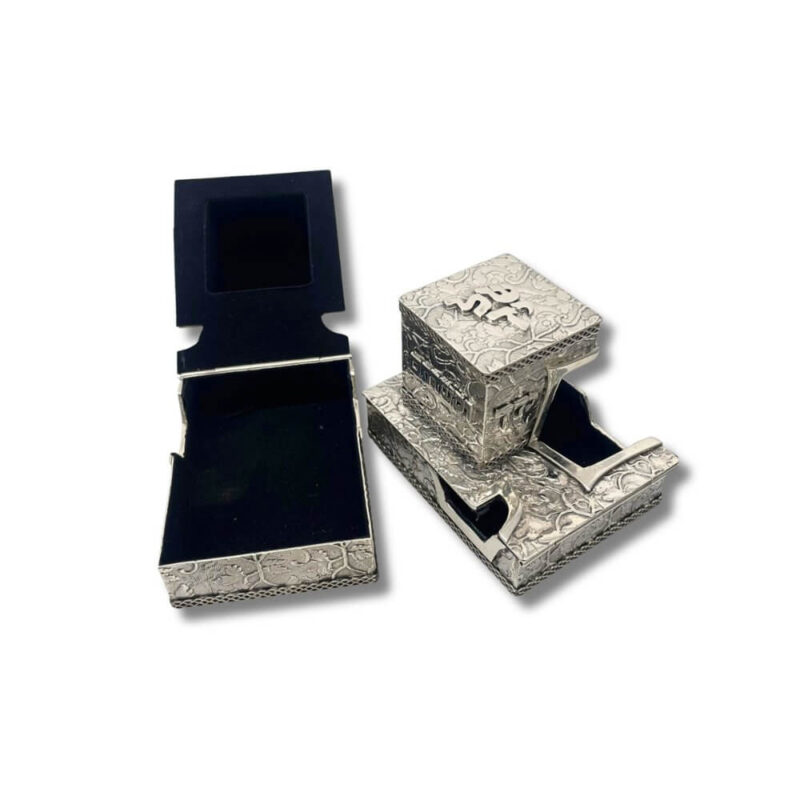 Back view of tefillin boxes showing Hebrew inscription "וקשרתם"