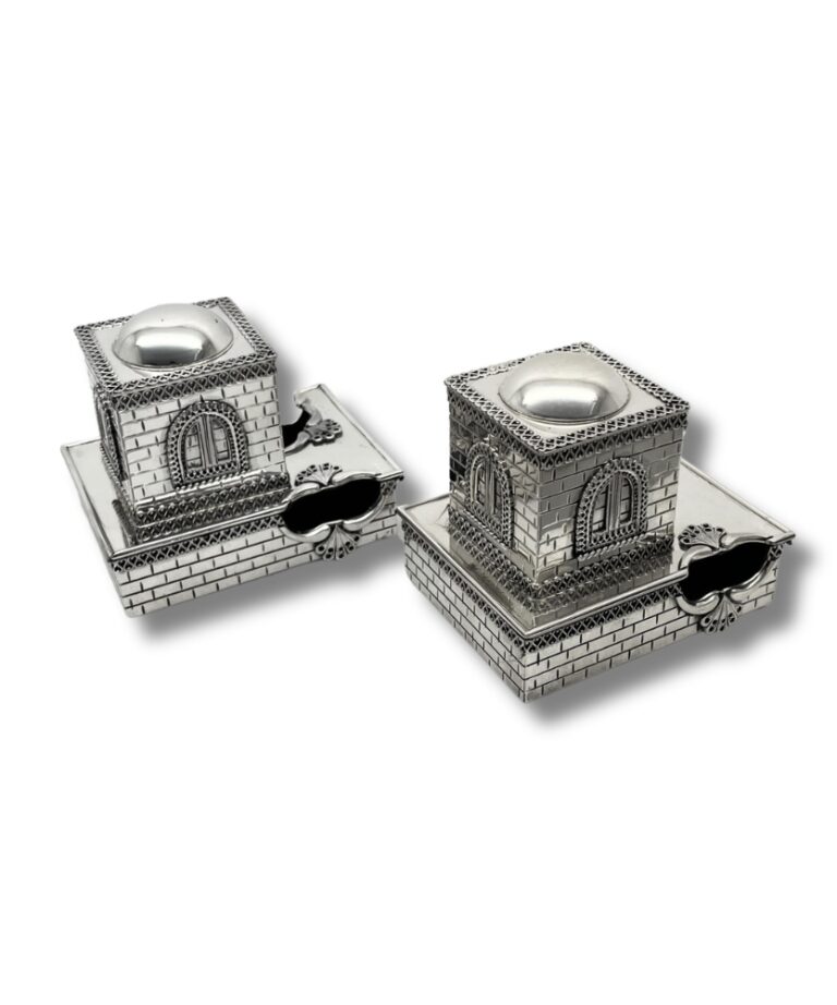 Detailed side angle of the tefillin boxes with ornate window and brick-style finish