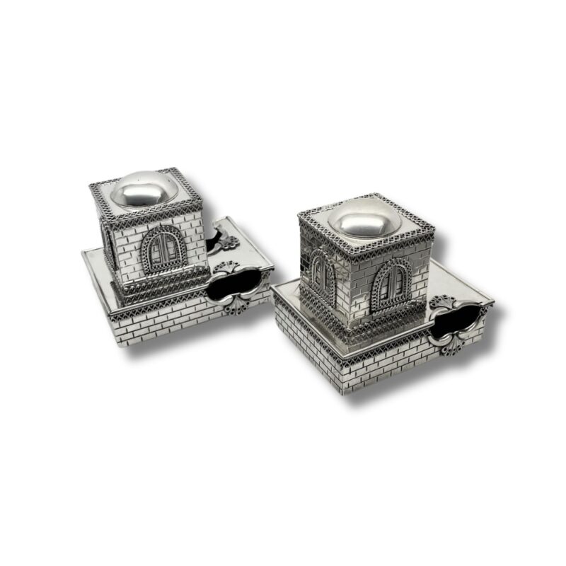 Detailed side angle of the tefillin boxes with ornate window and brick-style finish