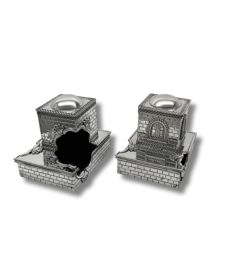 Open view of silver tefillin boxes showcasing interior detail and unique architectural style