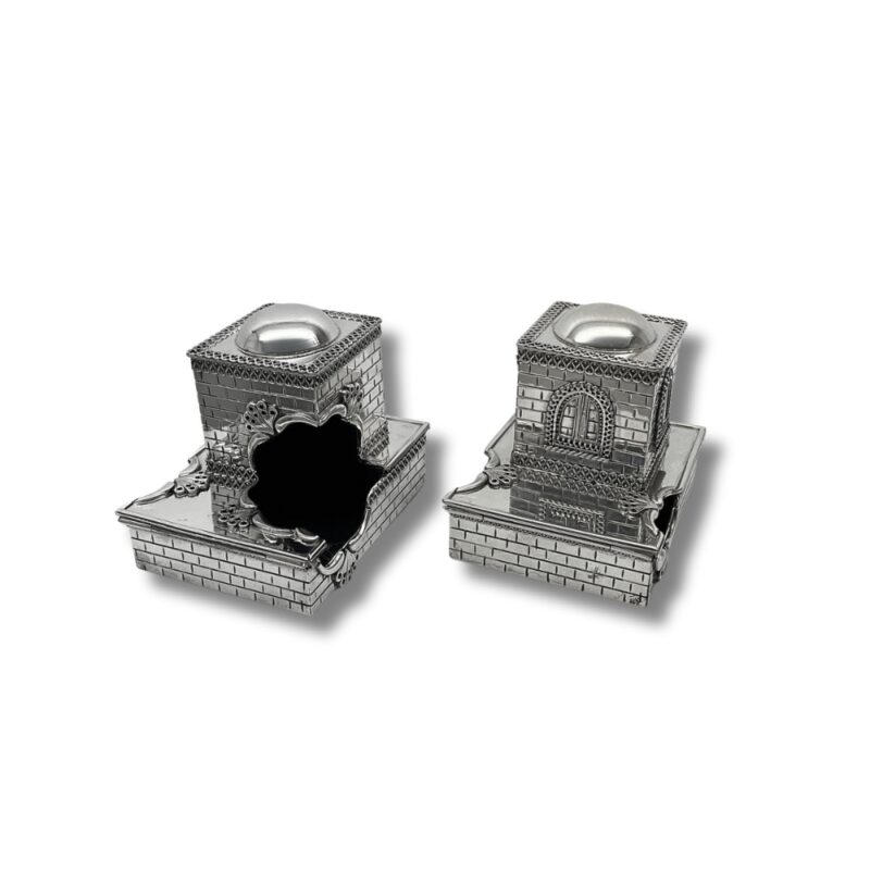 Open view of silver tefillin boxes showcasing interior detail and unique architectural style