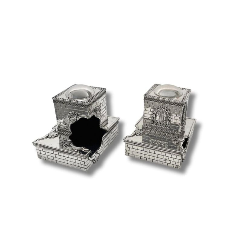 Open view of silver tefillin boxes showcasing interior detail and unique architectural style