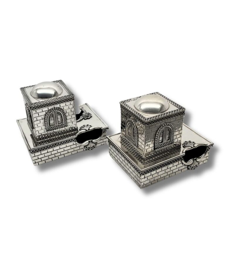 Detailed side angle of the tefillin boxes with ornate window and brick-style finish