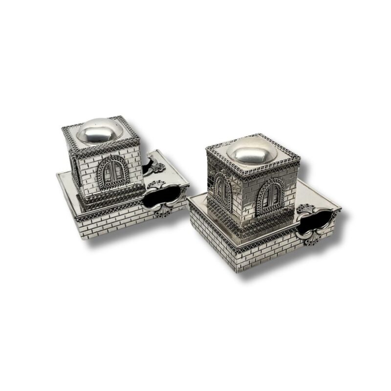 Detailed side angle of the tefillin boxes with ornate window and brick-style finish
